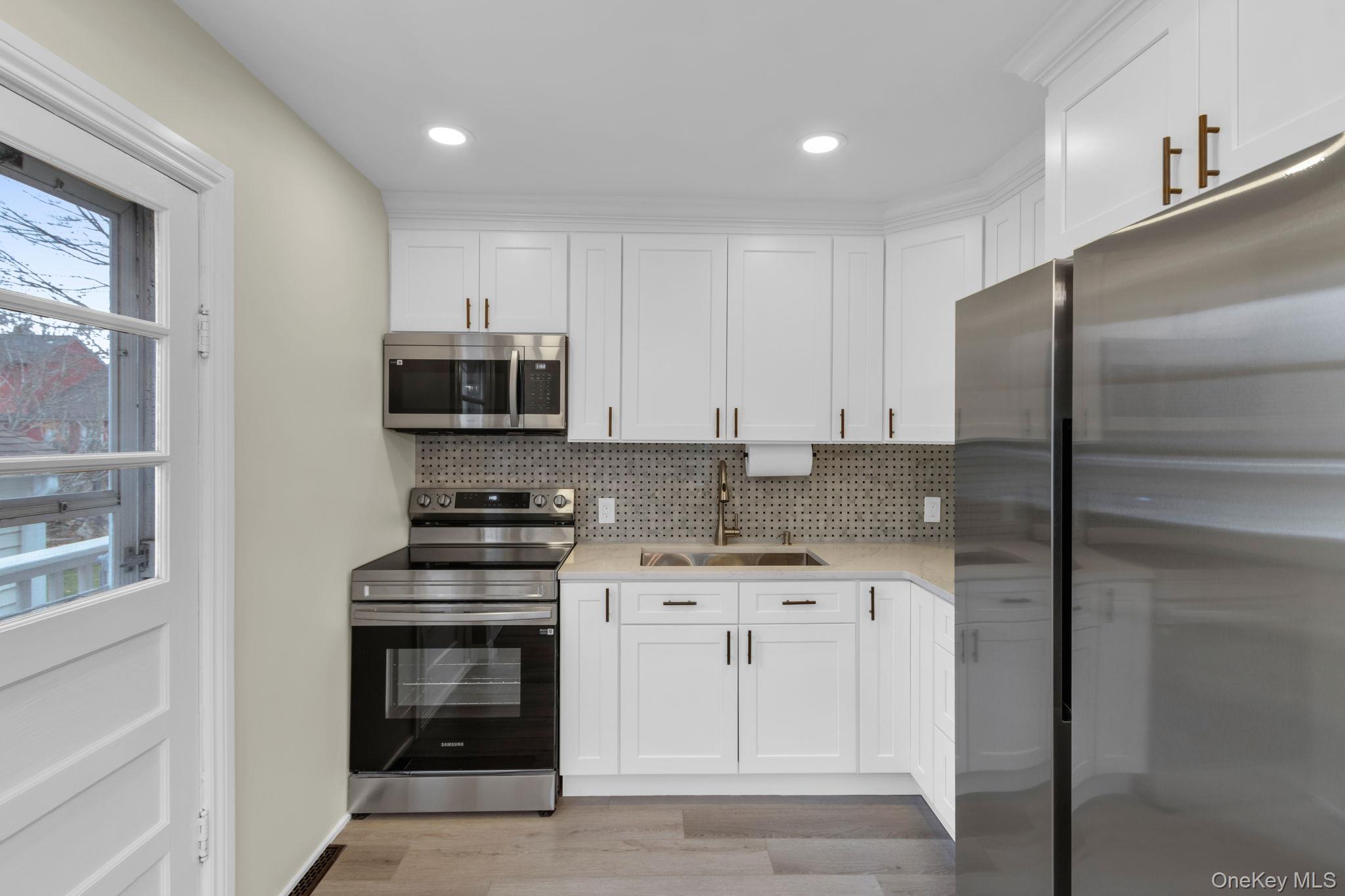 21 Reading Road Patterson, NY 12563 - Photo 11 of 39 a kitchen with stainless steel appliances granite countertop a stove a refrigerator and a microwave
