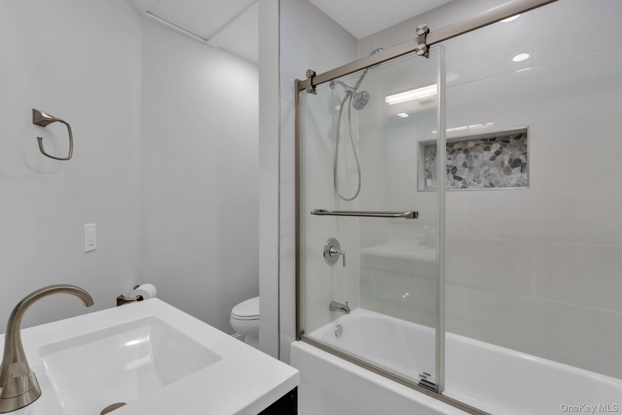 21 Reading Road Patterson, NY 12563 - Photo 26 of 39 a bathroom with a sink a mirror and a shower