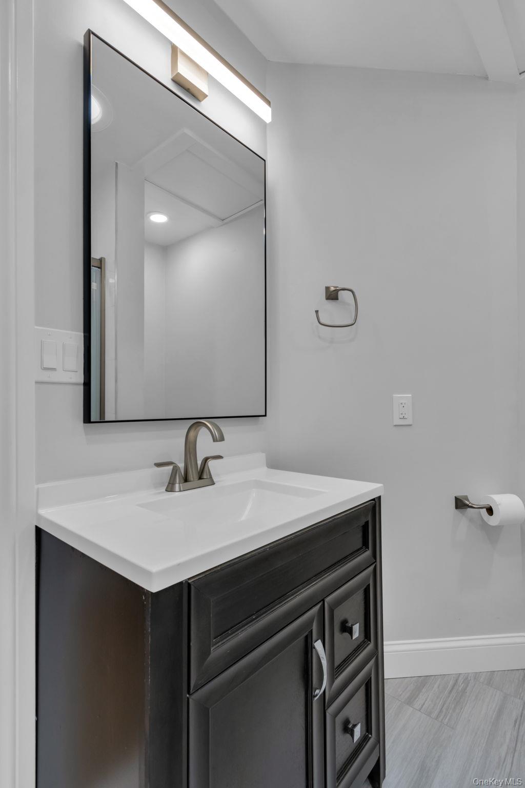 21 Reading Road Patterson, NY 12563 - Photo 27 of 39 a bathroom with a sink vanity and a mirror