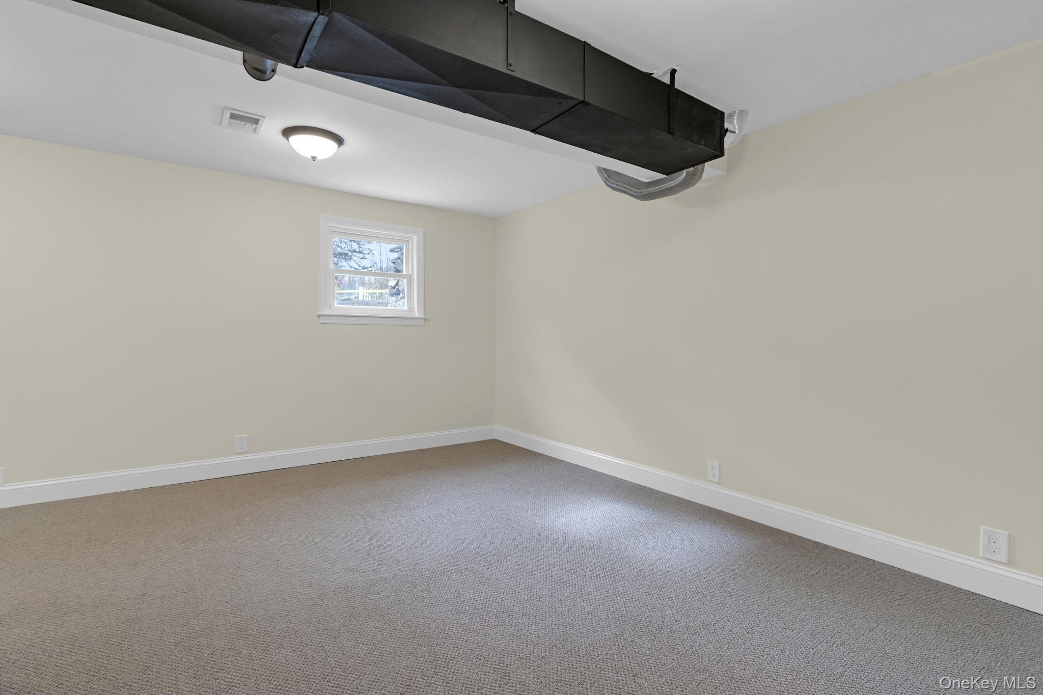 21 Reading Road Patterson, NY 12563 - Photo 29 of 39 an empty room with a empty space and windows