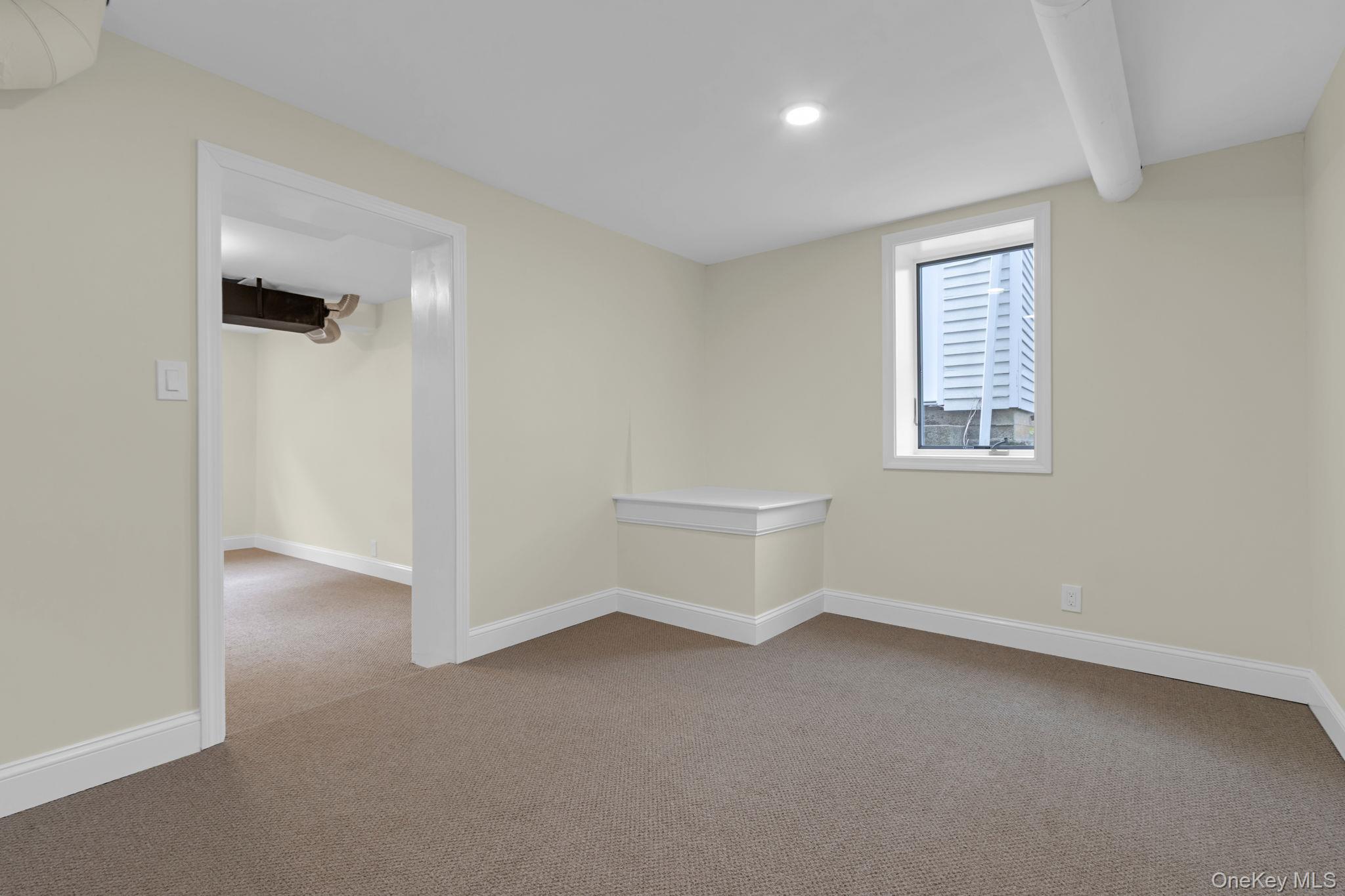 21 Reading Road Patterson, NY 12563 - Photo 33 of 39 an empty room with a white cabinet and a window
