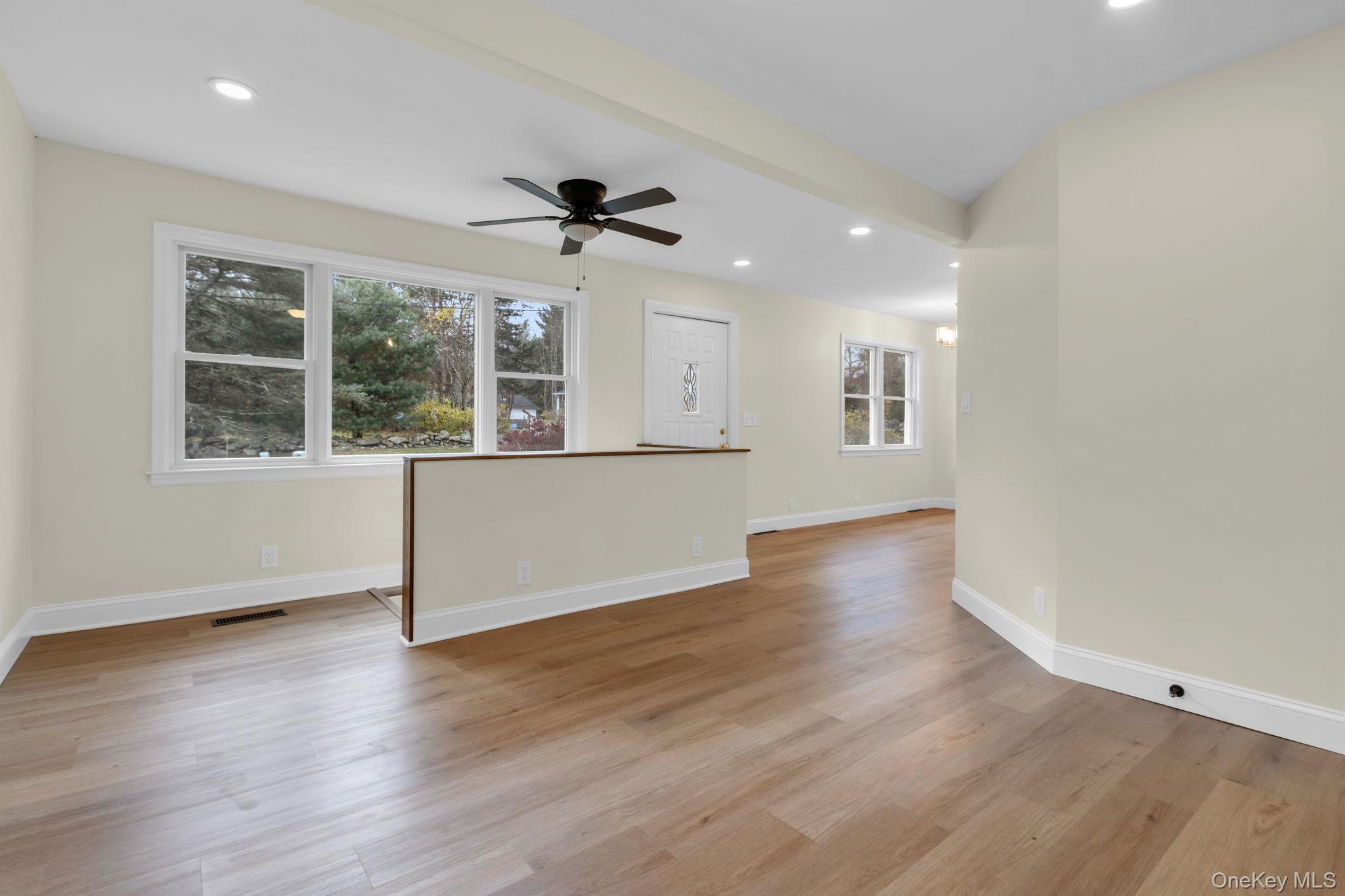 21 Reading Road Patterson, NY 12563 - Photo 4 of 39 a view of an empty room with wooden floor and a window
