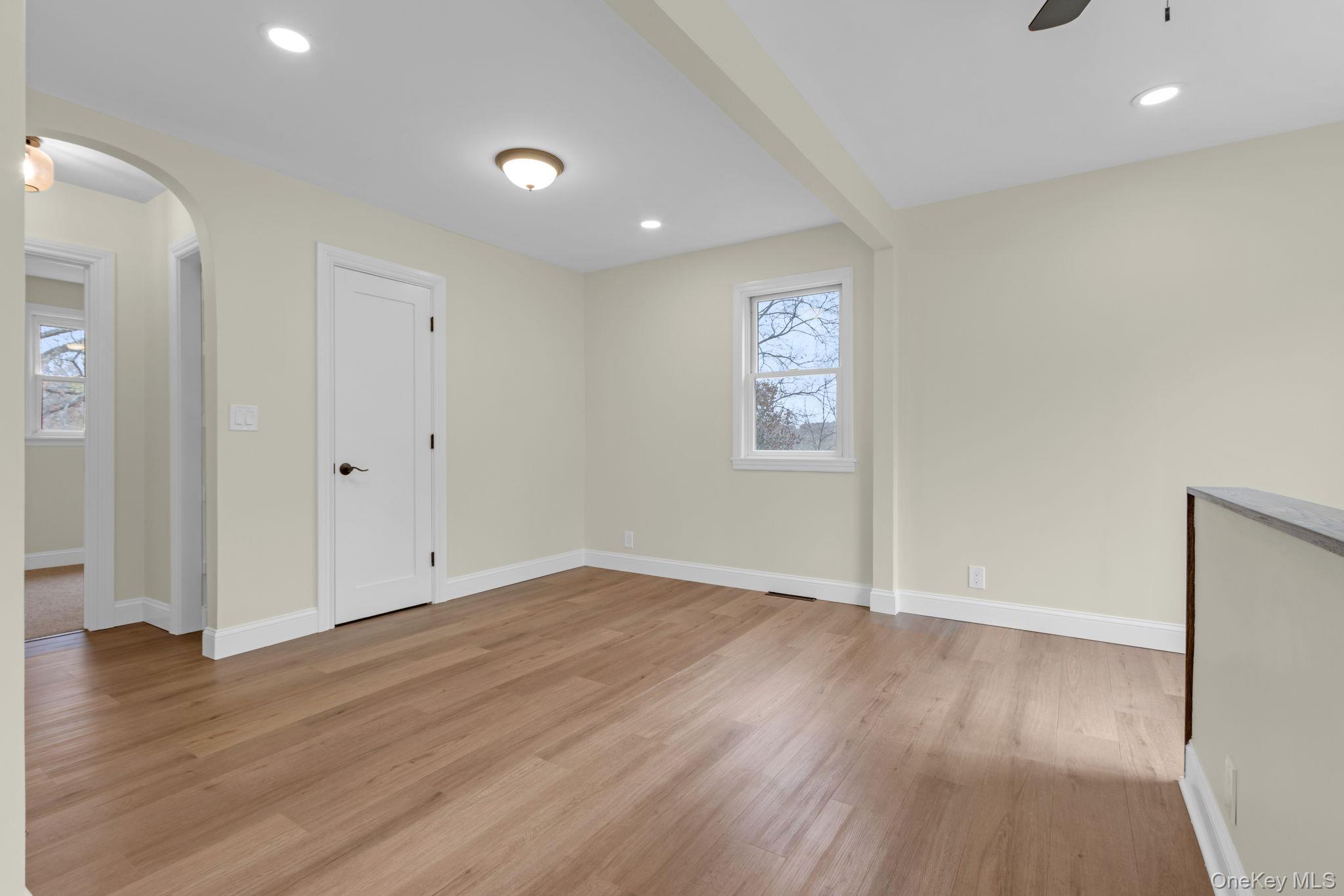 21 Reading Road Patterson, NY 12563 - Photo 6 of 39 an empty room with wooden floor and windows
