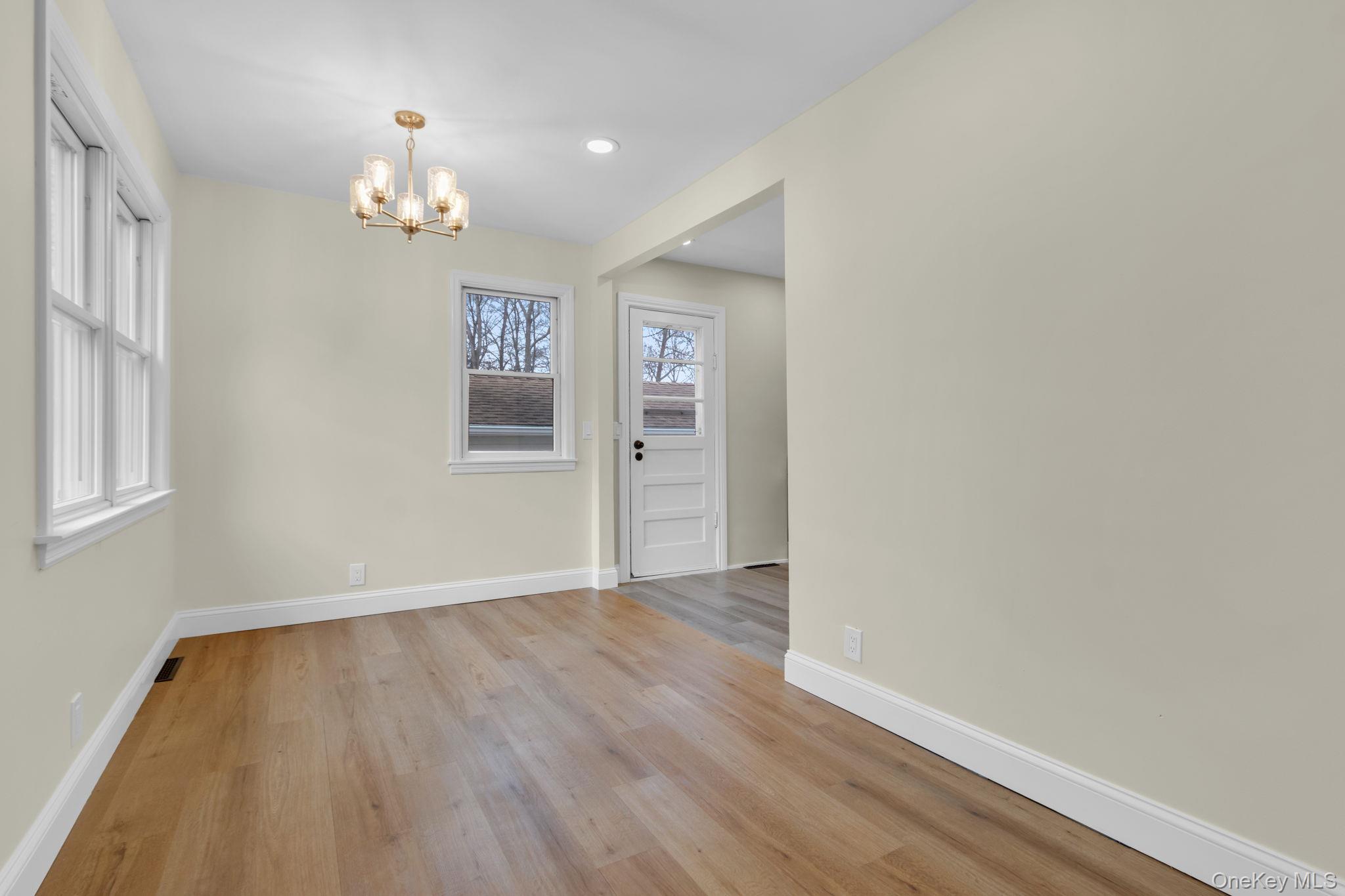 21 Reading Road Patterson, NY 12563 - Photo 8 of 39 wooden floor in an empty room with a window