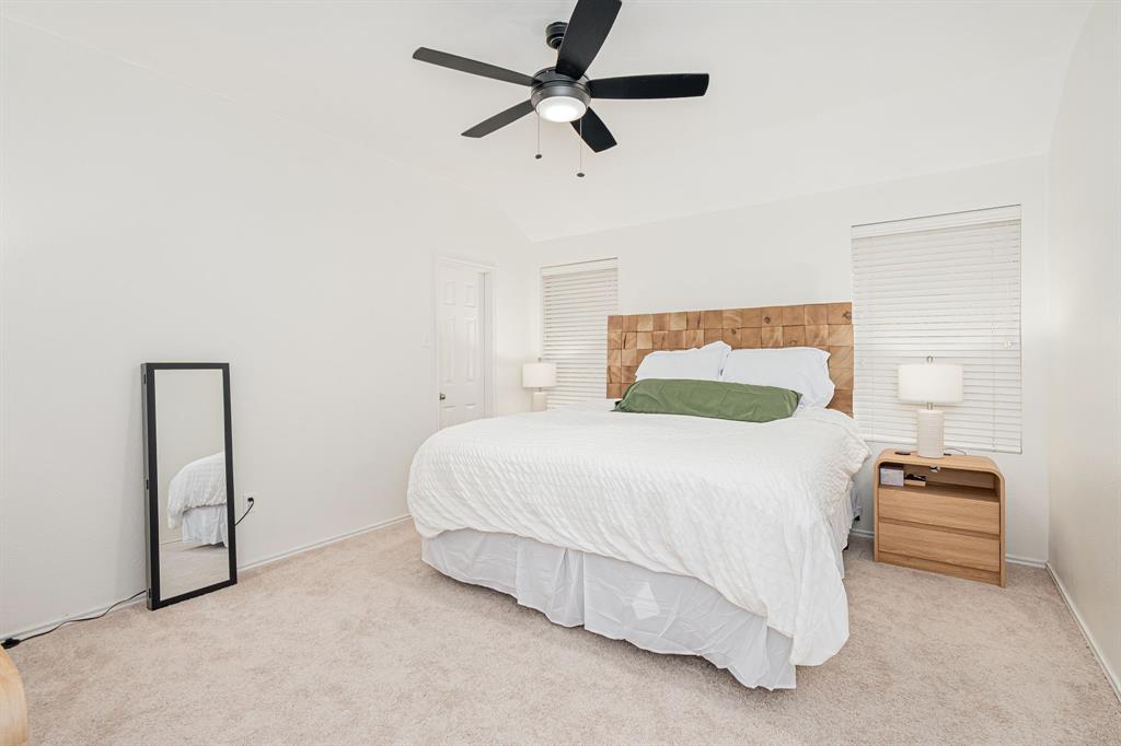 3521 Camino Real Trail Denton, TX 76208 - Photo 11 of 28 a bedroom with a bed and a ceiling fan