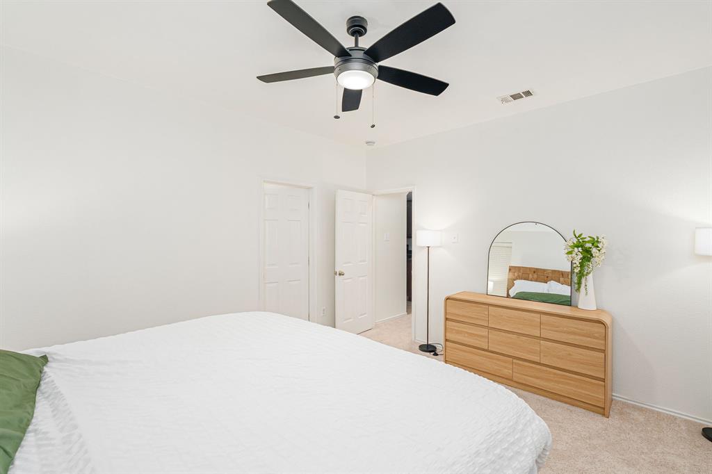 3521 Camino Real Trail Denton, TX 76208 - Photo 12 of 28 a bedroom with a bed and a ceiling fan