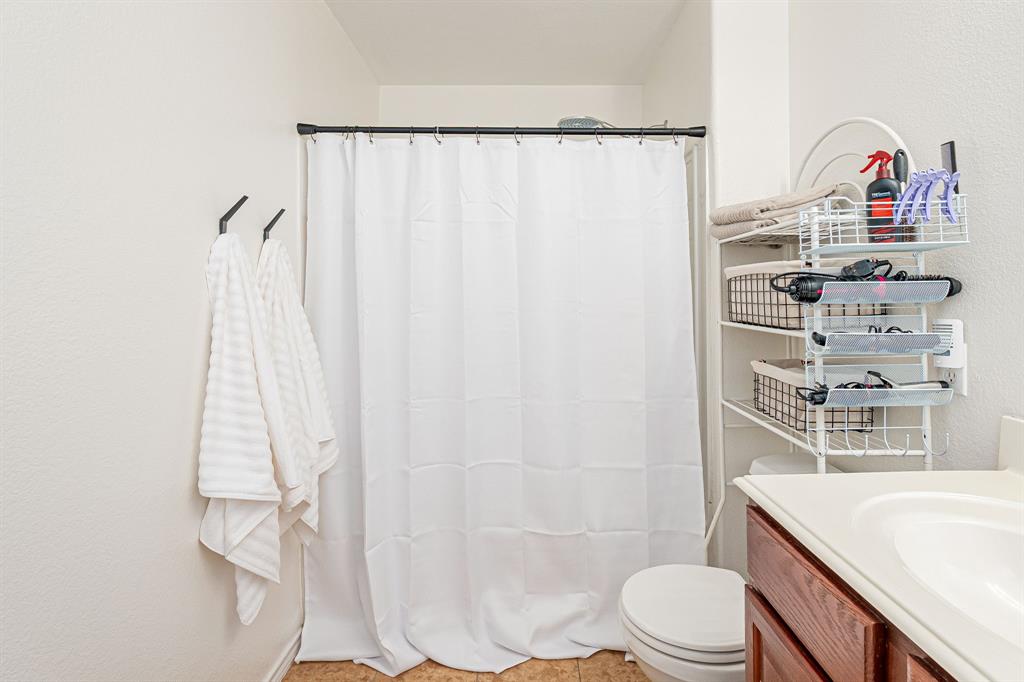 3521 Camino Real Trail Denton, TX 76208 - Photo 13 of 28 a bathroom with a sink toilet and shower
