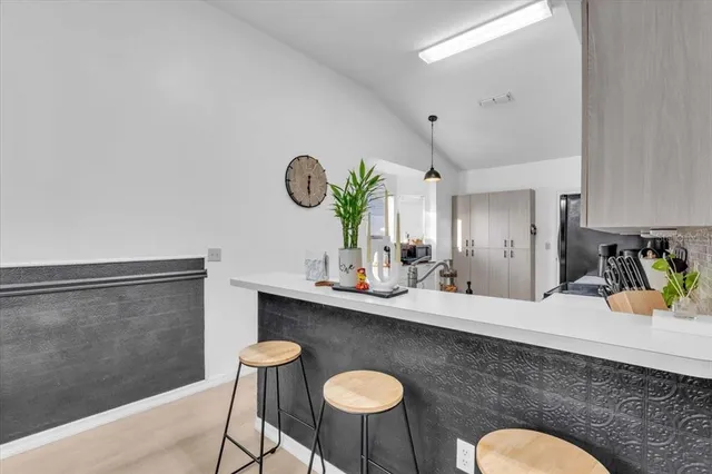 a kitchen with a table and chairs in it