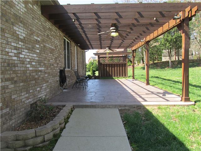 3555 Rabbit Run Trail Clarksville, TN 37043 - Photo 18 of 19 Photo of the Rear of Home Features New Custom Stamped Concrete Patio and a Beautiful Pergola.