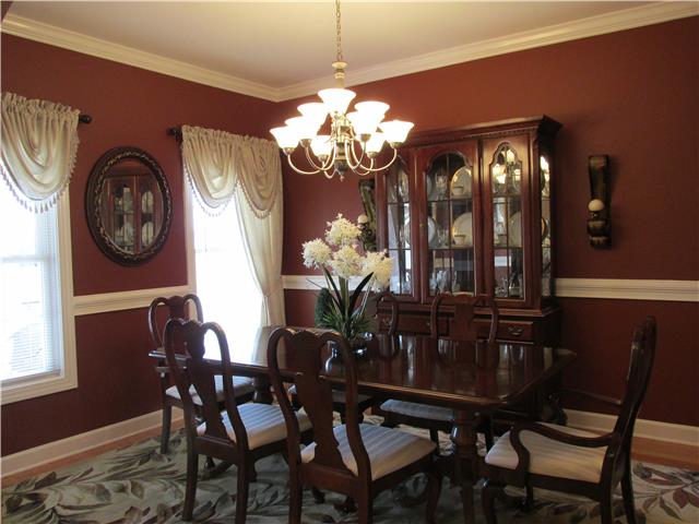 3555 Rabbit Run Trail Clarksville, TN 37043 - Photo 6 of 19 12x14 Formal Dining with Hardwood Floor, Crown Molding, Floor Length Windows, Chair Rail and a Gorgeous Chandler.