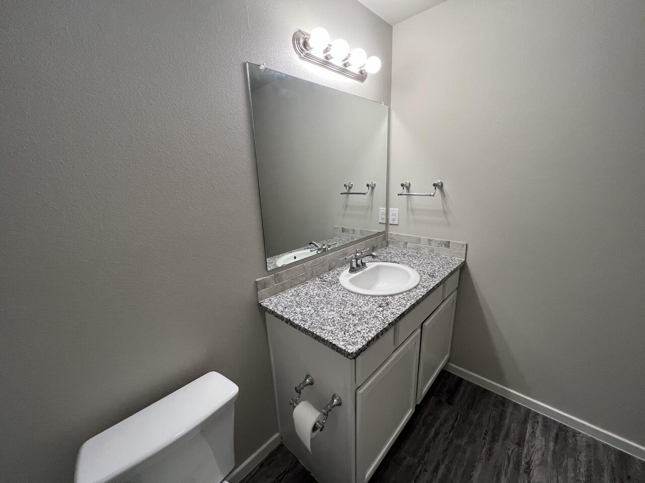 2139 North Texas Avenue, Unit A Lubbock, TX 79403 - Photo 16 of 21 a bathroom with a sink toilet and vanity