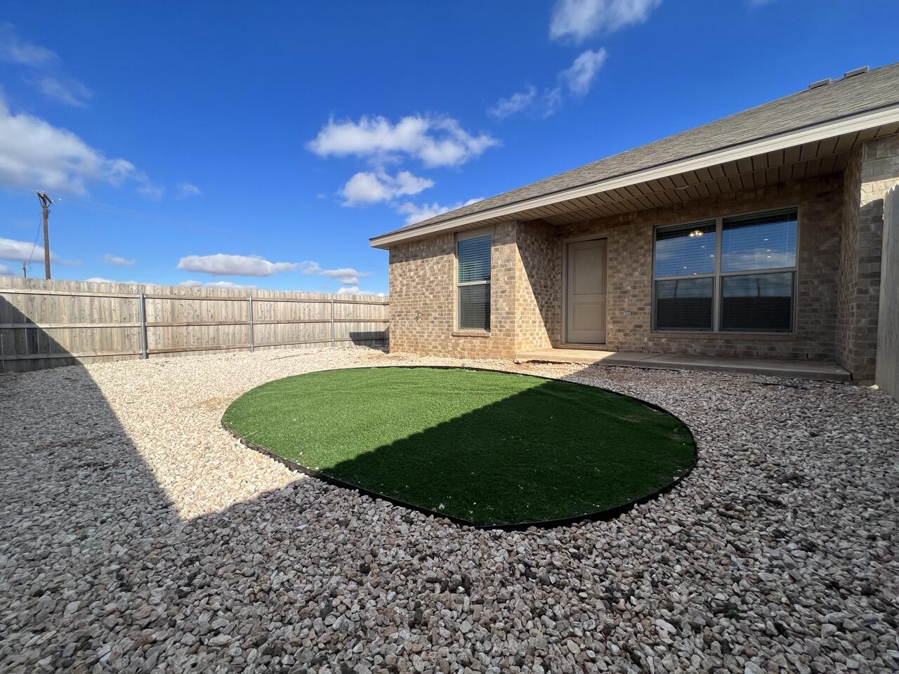 2139 North Texas Avenue, Unit A Lubbock, TX 79403 - Photo 21 of 21 a view of a backyard with a garden