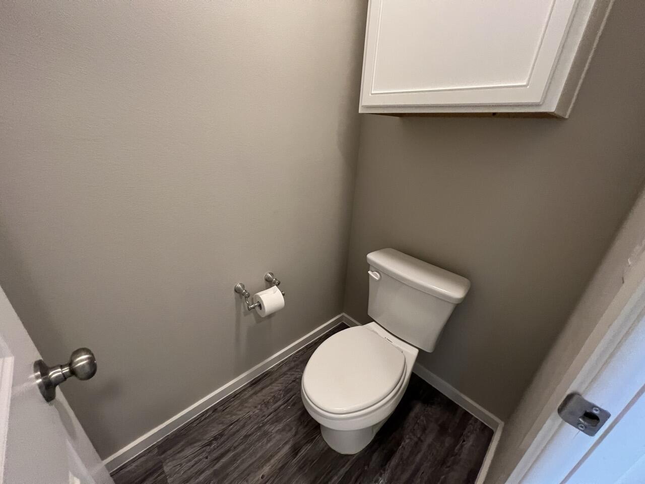 2139 North Texas Avenue, Unit A Lubbock, TX 79403 - Photo 10 of 21 a white toilet sitting next to a window