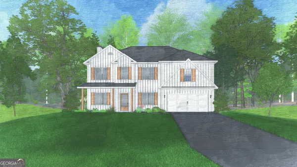 a front view of a house with a yard and trees