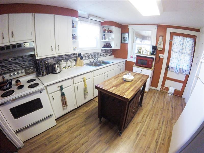 4407 Ellwood Road New Castle, PA 16101 - Photo 6 of 25 The scratch resistant floor in the kitchen is brand new!