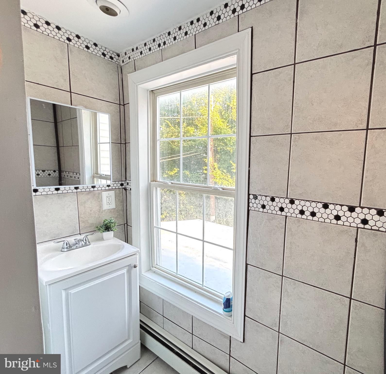 518 Columbus Road Burlington, NJ 08016 - Photo 13 of 26 a bathroom with a sink and a shower