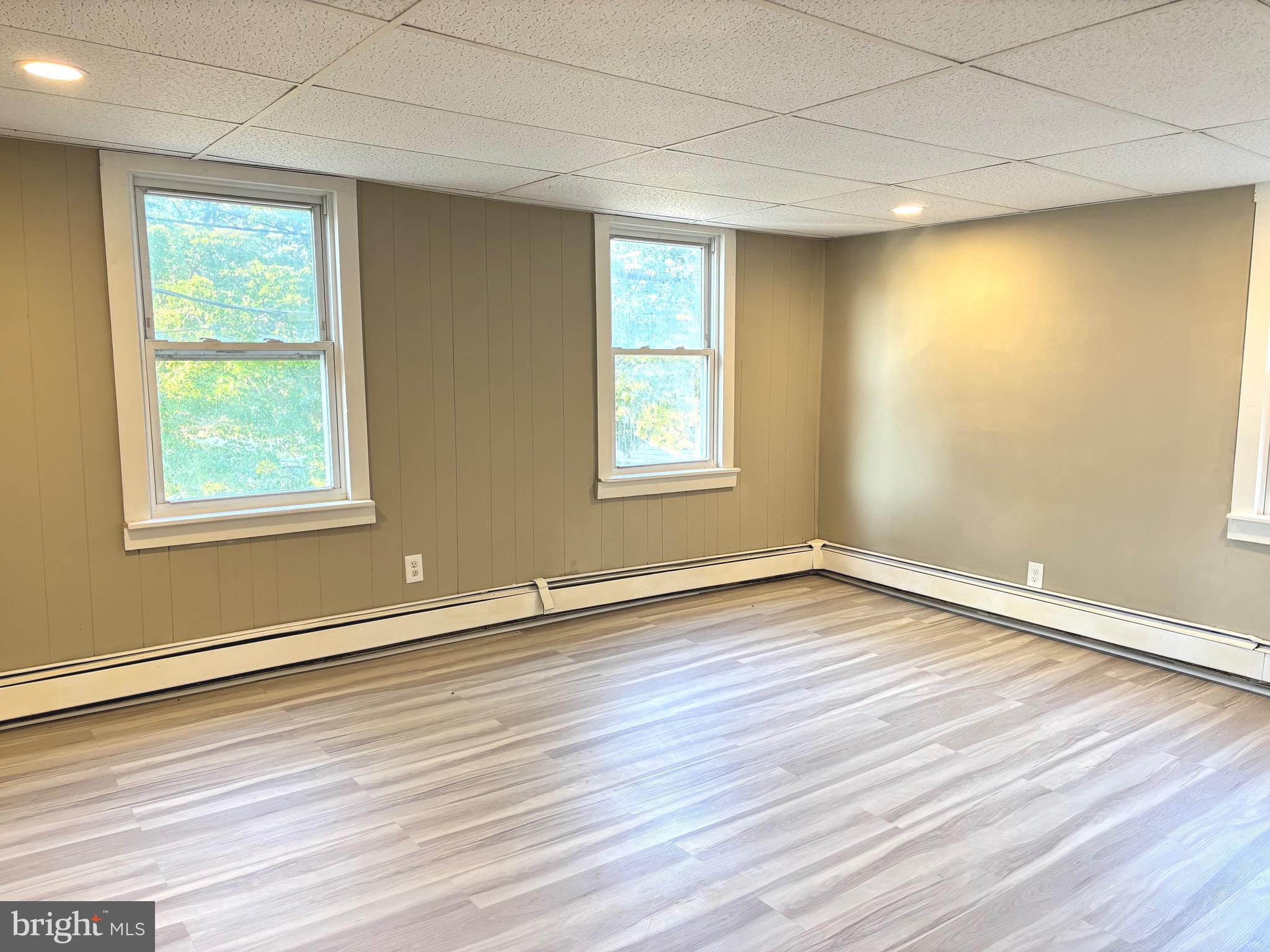 518 Columbus Road Burlington, NJ 08016 - Photo 19 of 26 a view of an empty room with wooden floor and a window