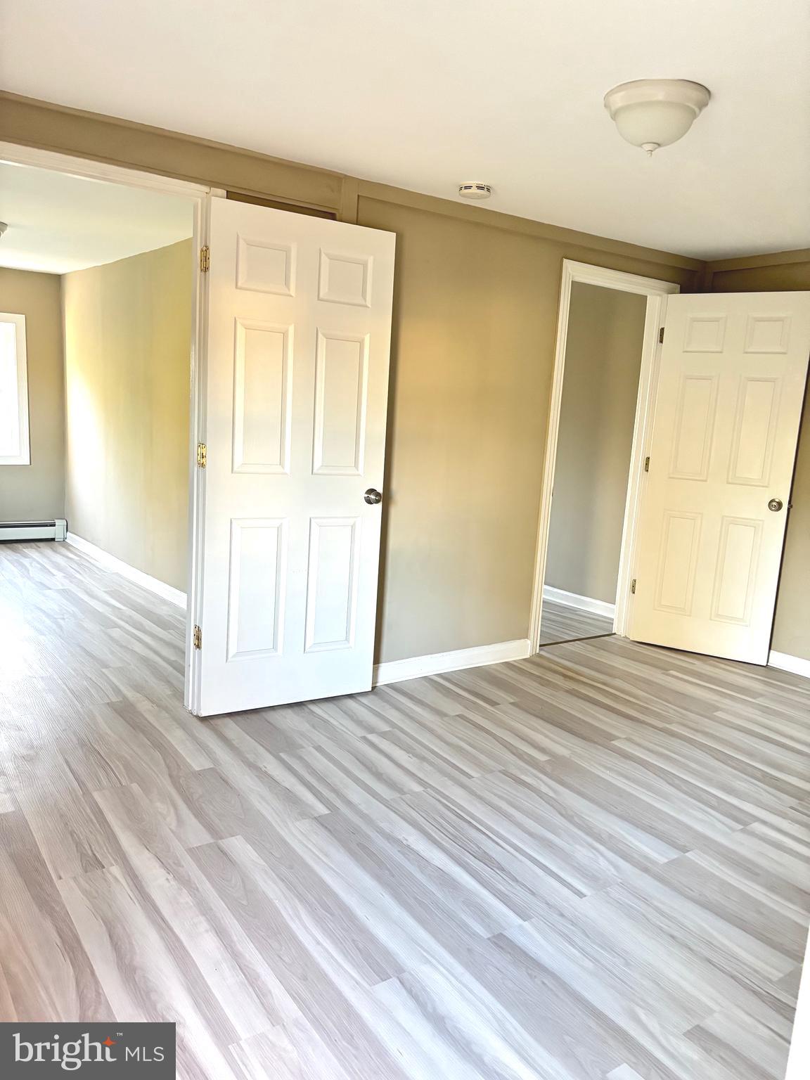 518 Columbus Road Burlington, NJ 08016 - Photo 22 of 26 a view of an empty room with wooden floor