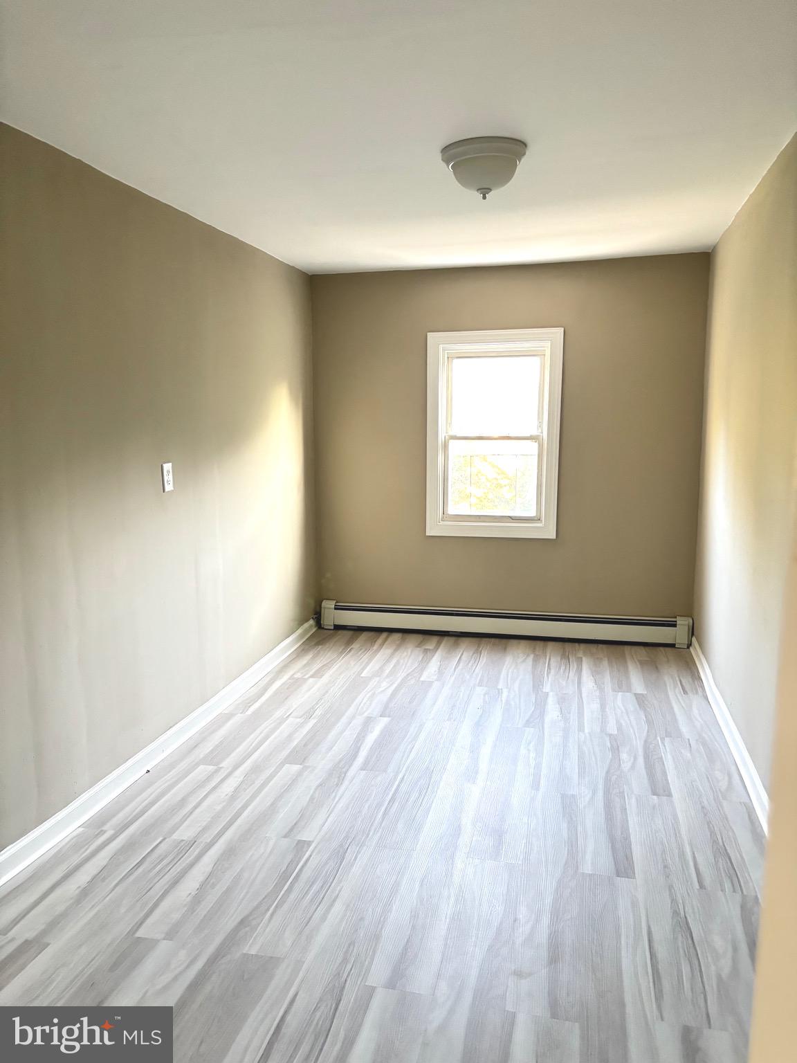 518 Columbus Road Burlington, NJ 08016 - Photo 24 of 26 an empty room with wooden floor and windows