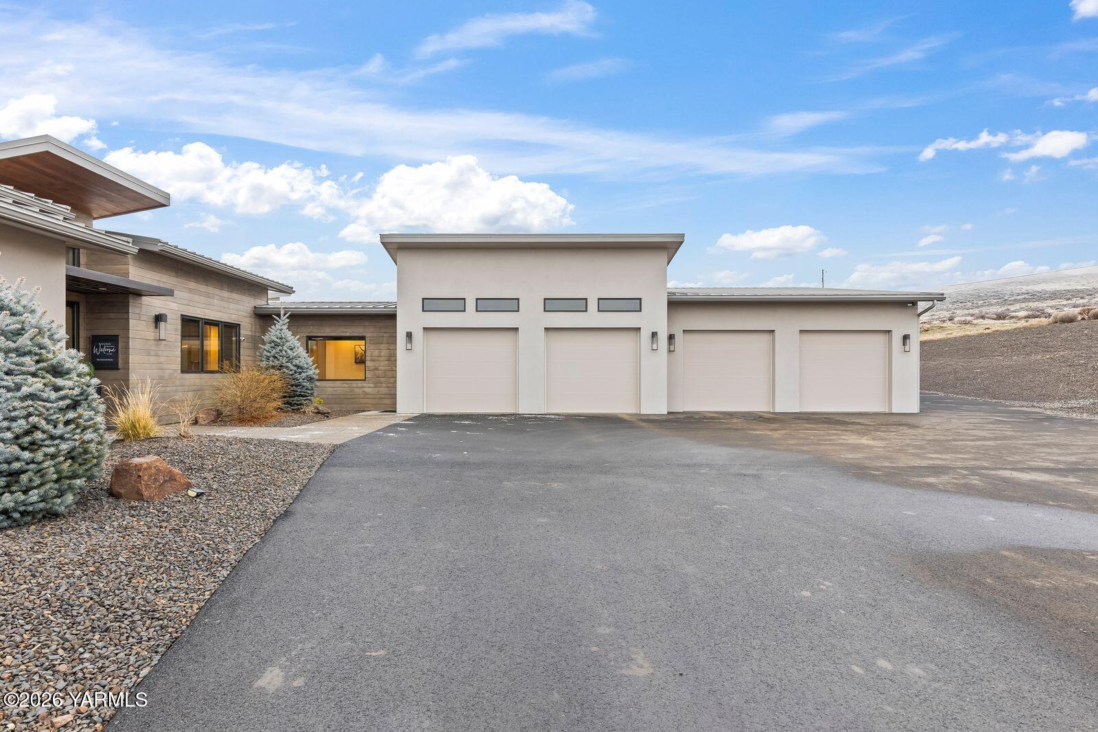 13990 Marble Road Yakima, WA 98908 - Photo 5 of 60 a view of a house with a yard and garage