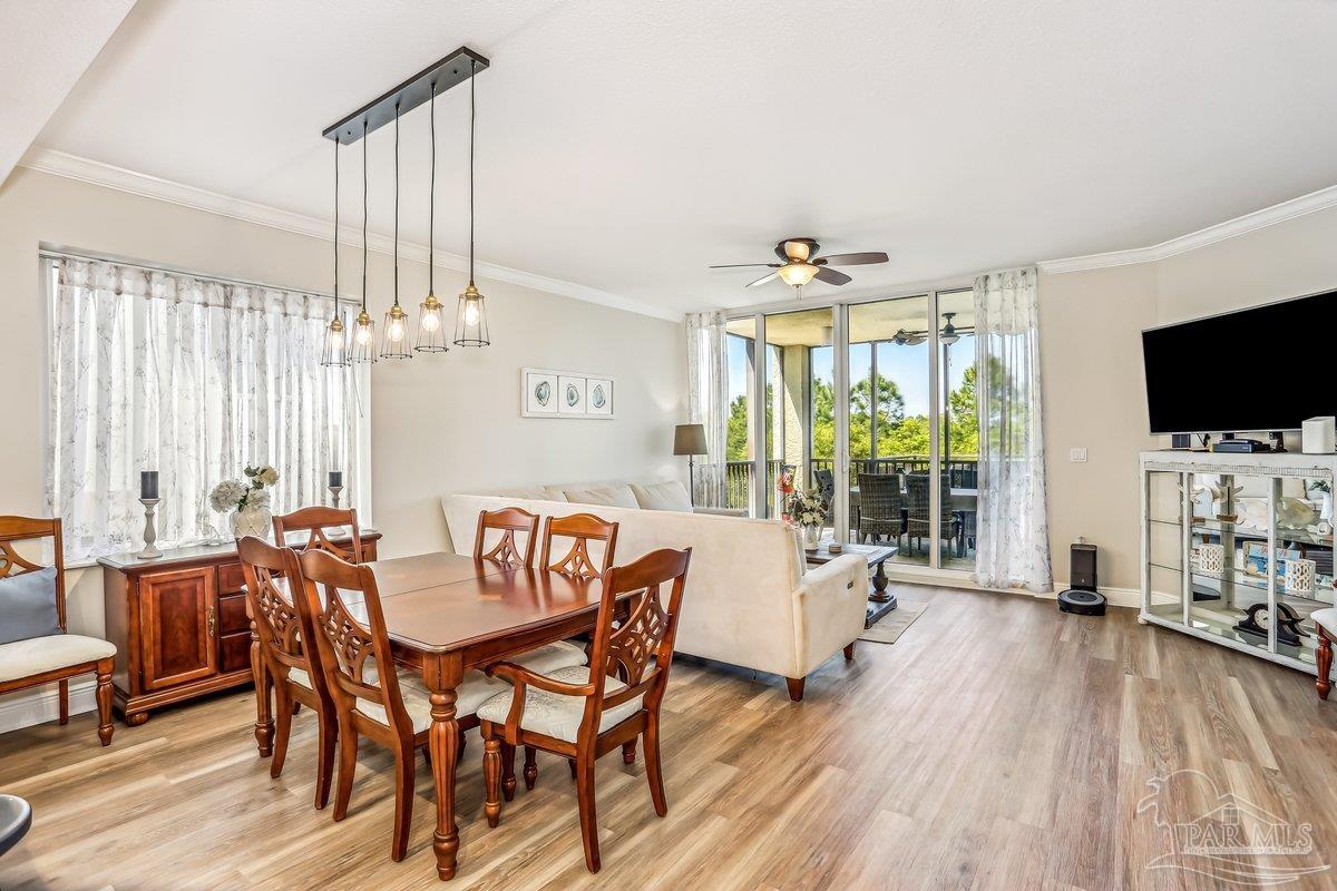 608 Lost Key Drive, Unit 201C Perdido Key, FL 32507 - Photo 11 of 42 a view of a livingroom with furniture window and wooden floor