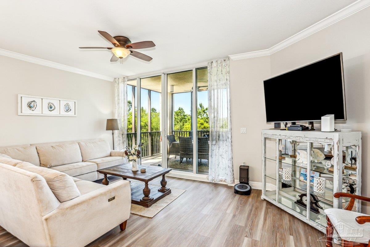 608 Lost Key Drive, Unit 201C Perdido Key, FL 32507 - Photo 12 of 42 a living room with furniture and a flat screen tv
