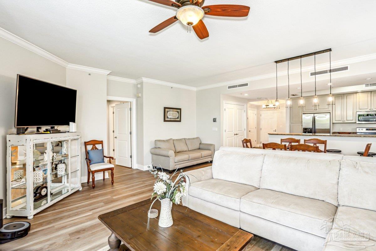 608 Lost Key Drive, Unit 201C Perdido Key, FL 32507 - Photo 14 of 42 a living room with furniture and a flat screen tv