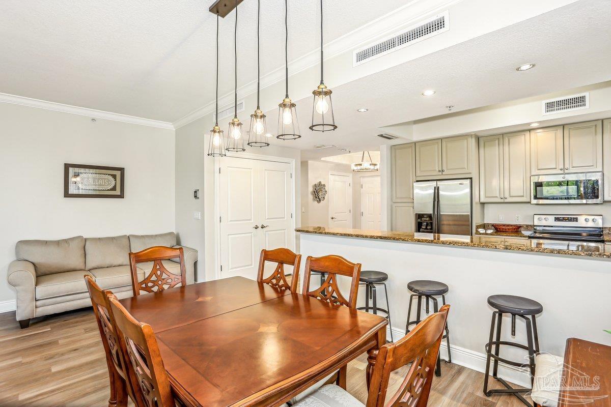 608 Lost Key Drive, Unit 201C Perdido Key, FL 32507 - Photo 16 of 42 a dining room with furniture and window