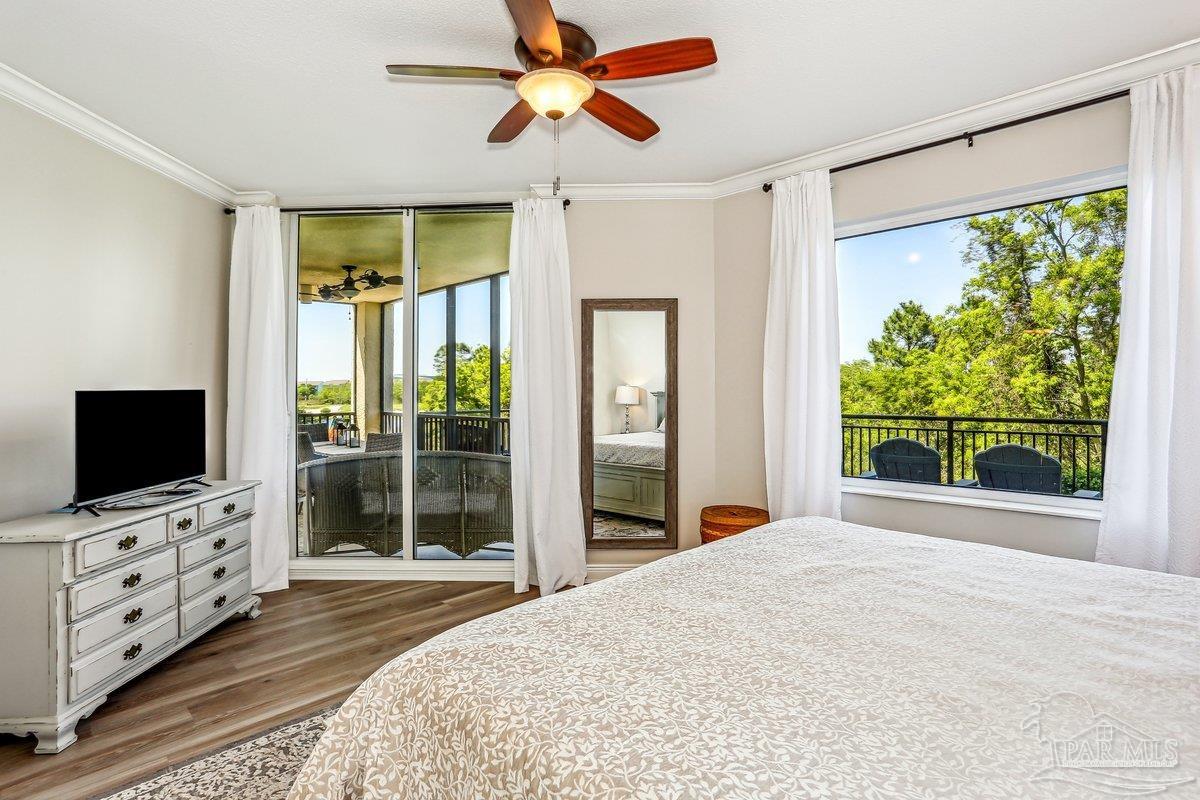 608 Lost Key Drive, Unit 201C Perdido Key, FL 32507 - Photo 18 of 42 a bedroom with furniture and a flat screen tv