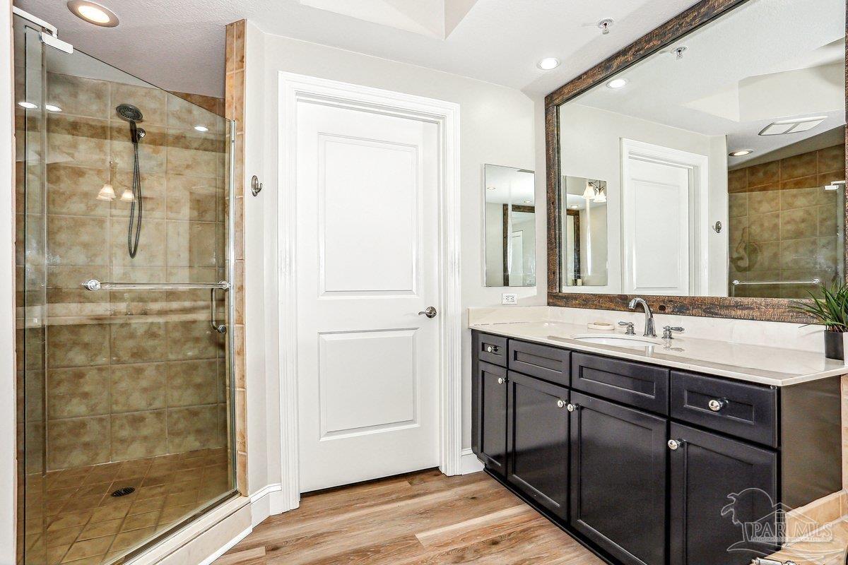 608 Lost Key Drive, Unit 201C Perdido Key, FL 32507 - Photo 21 of 42 a bathroom with a shower sink and mirror