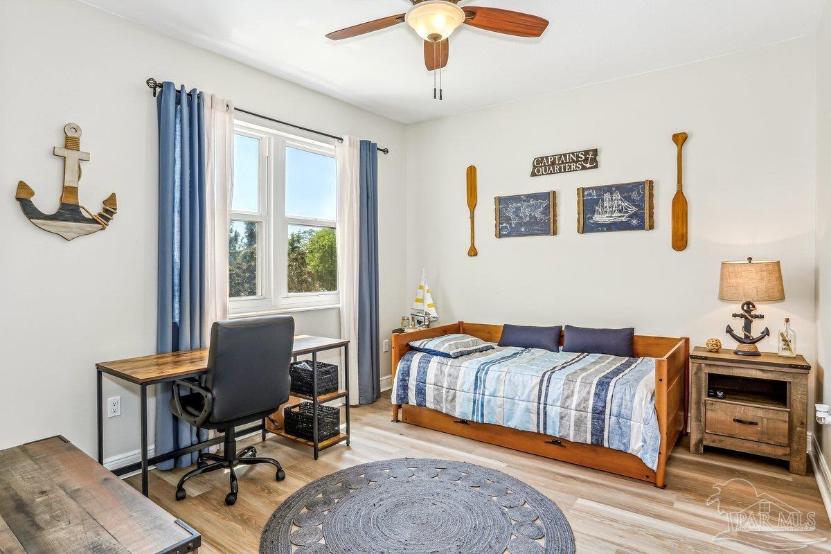 608 Lost Key Drive, Unit 201C Perdido Key, FL 32507 - Photo 22 of 42 a bedroom with furniture and a window