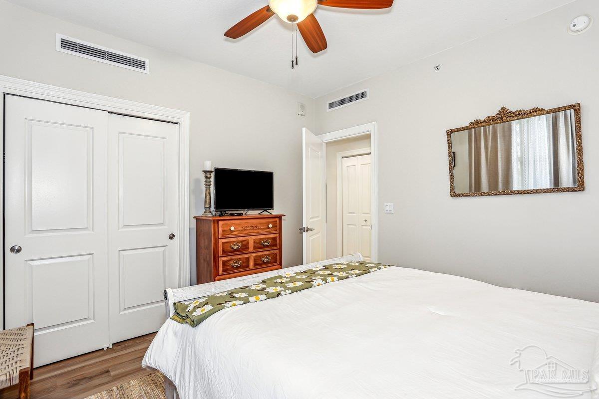 608 Lost Key Drive, Unit 201C Perdido Key, FL 32507 - Photo 25 of 42 a bedroom with a bed and a flat screen tv