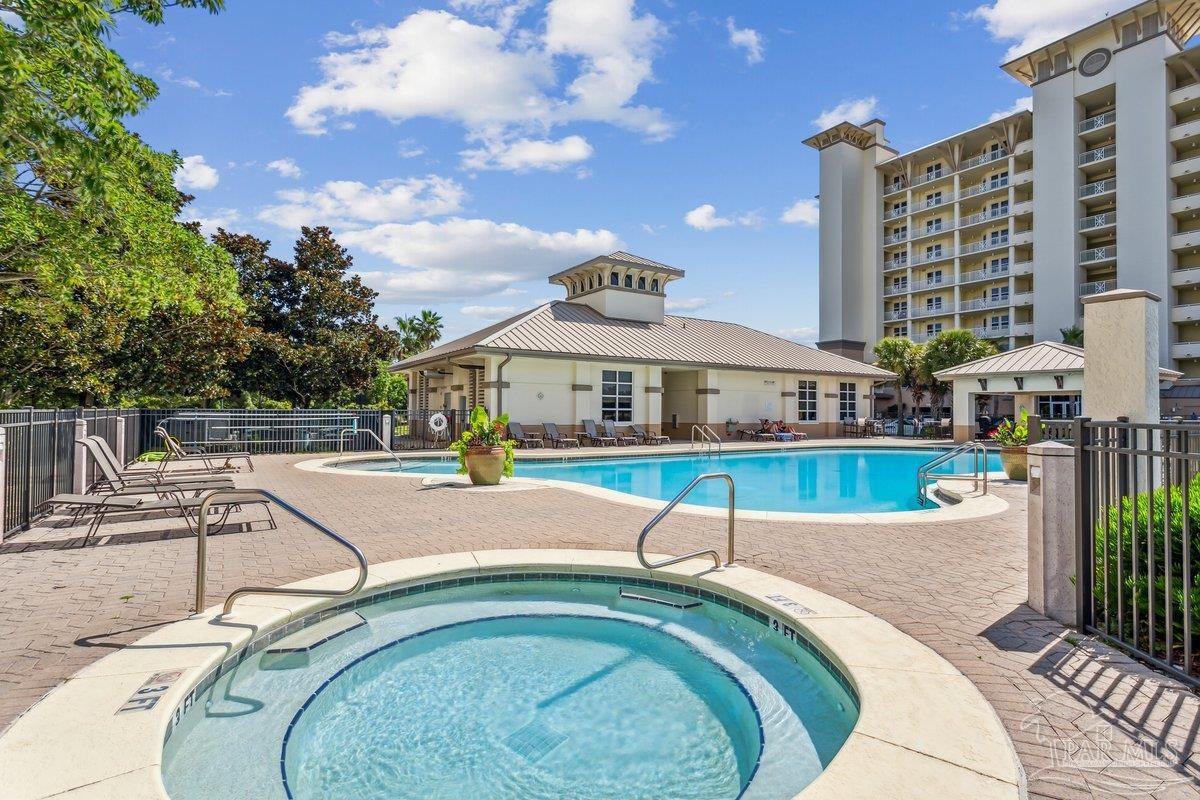 608 Lost Key Drive, Unit 201C Perdido Key, FL 32507 - Photo 34 of 42 a swimming pool with outdoor seating and yard
