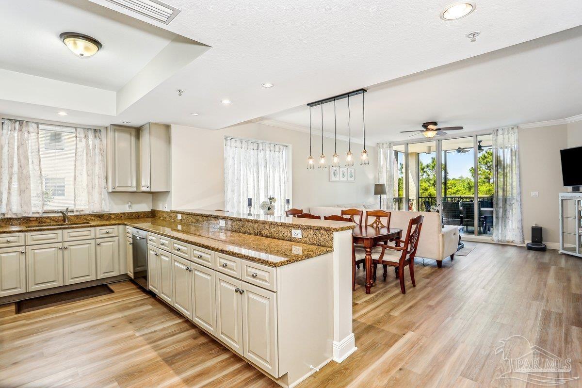 608 Lost Key Drive, Unit 201C Perdido Key, FL 32507 - Photo 7 of 42 a large white kitchen with a large window and stainless steel appliances