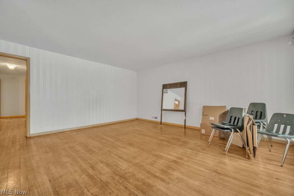 6846 Revere Road Cleveland, OH 44130 - Photo 14 of 30 Sitting room with light wood-style flooring and baseboards