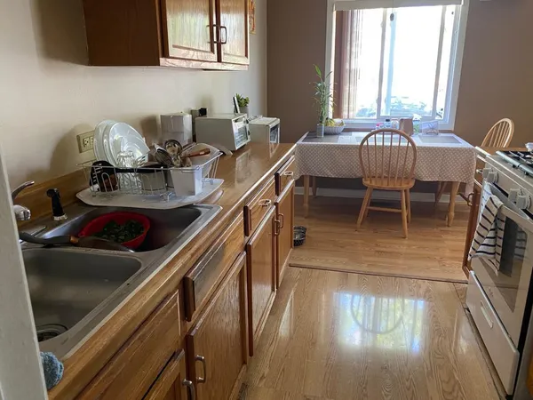 a dining room with furniture and a window