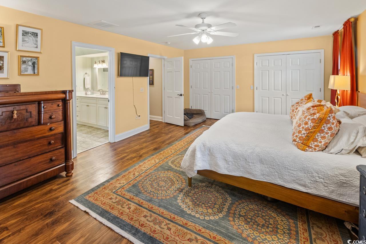 1007 Pyatt Street Georgetown, SC 29440 - Photo 18 of 31 Bedroom featuring two closets, ceiling fan, visibl