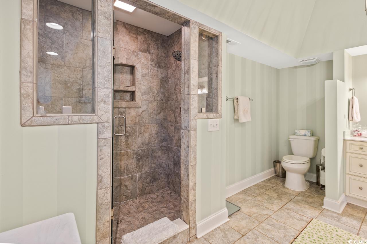 1007 Pyatt Street Georgetown, SC 29440 - Photo 20 of 31 Bathroom with baseboards, toilet, a shower stall,
