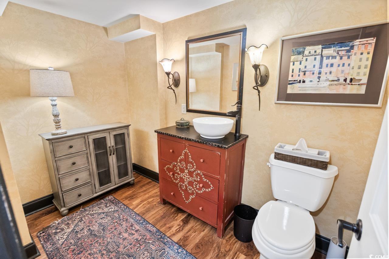 1007 Pyatt Street Georgetown, SC 29440 - Photo 27 of 31 Bathroom with toilet, wood finished floors, and va