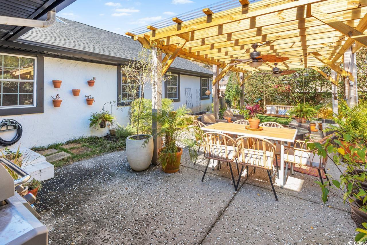 1007 Pyatt Street Georgetown, SC 29440 - Photo 28 of 31 View of patio featuring a pergola and outdoor dini