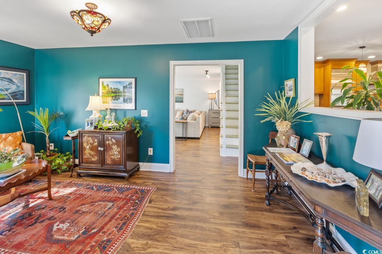 1007 Pyatt Street Georgetown, SC 29440 - Photo 9 of 31 Living area with wood finished floors, baseboards,