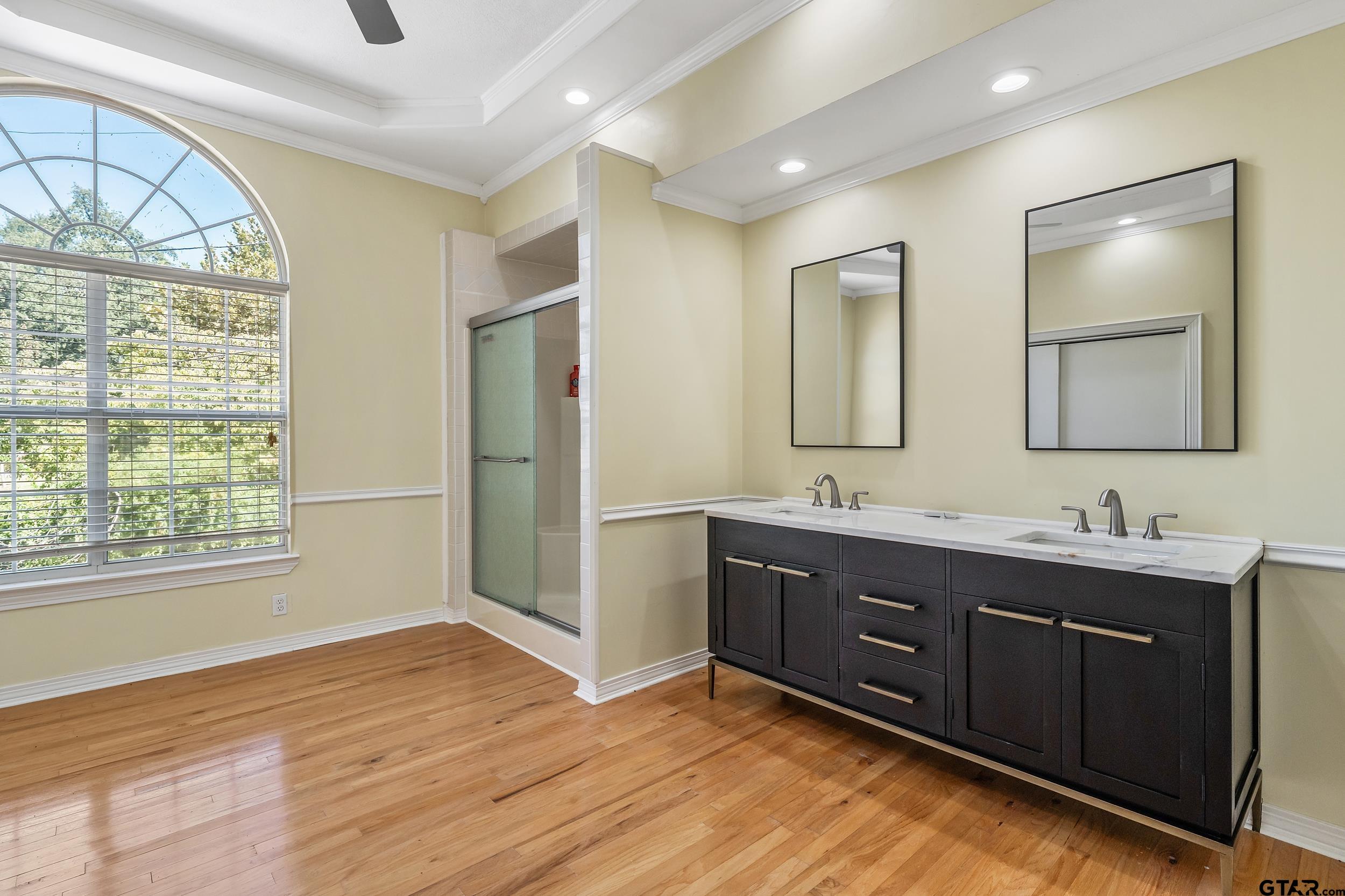 145 Rowland Place Tyler, TX 75701 - Photo 17 of 43 a bathroom with a sink mirror and a window