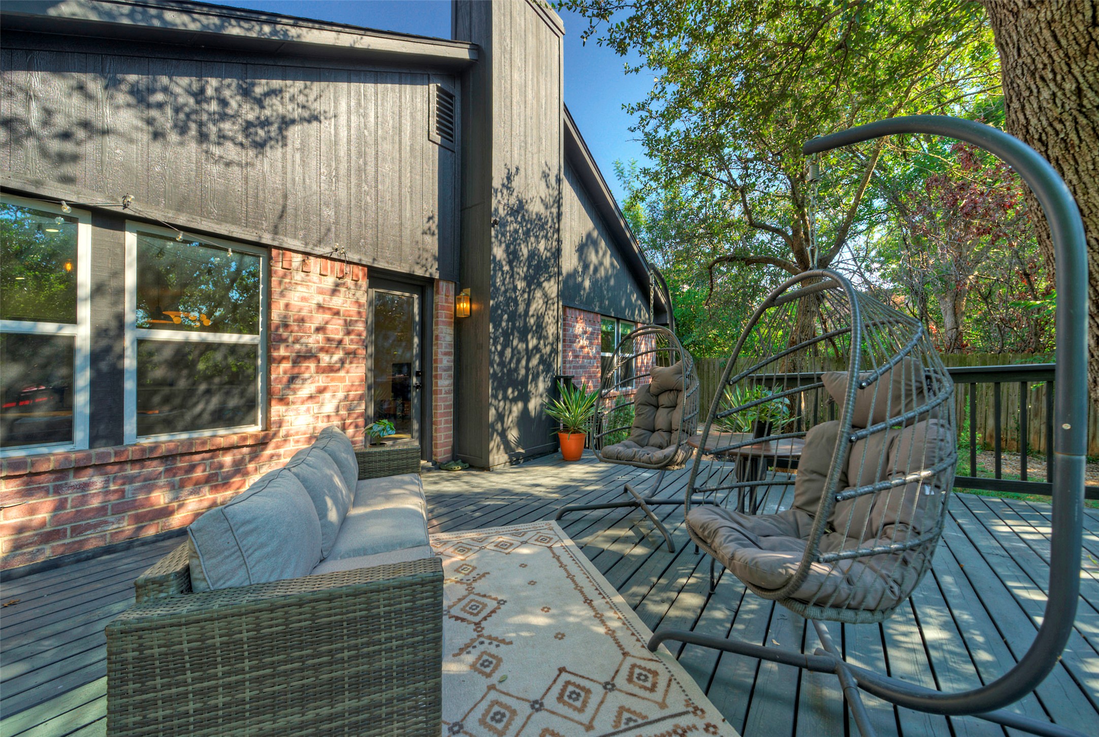 8406 Los Ranchos Drive Austin, TX 78749 - Photo 28 of 32 A spacious wooden deck provides an inviting outdoor living area for relaxation.