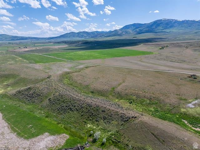22000 South Marsh Valley Road Downey, ID 83234 - Photo 3 of 8 Overview of rural landscape featuring a mountain backdrop