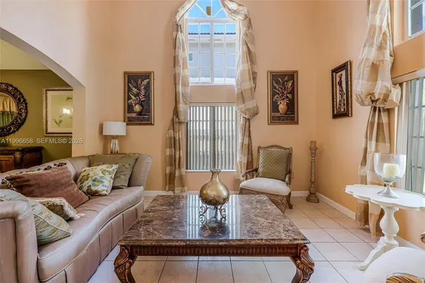 a living room with furniture and a large window