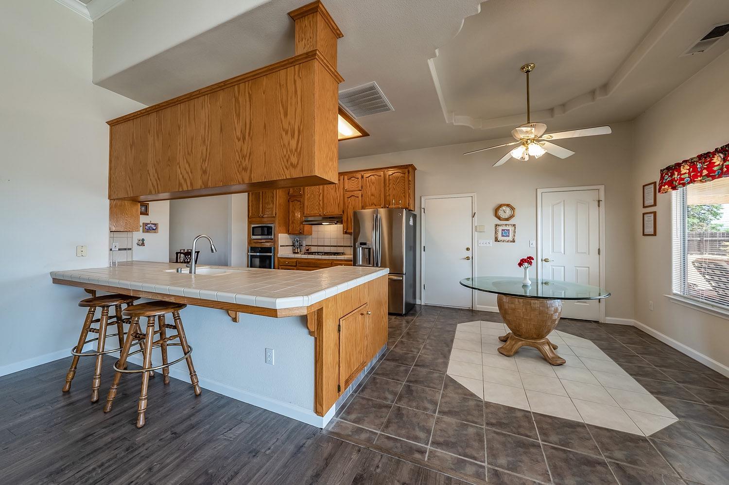 16601 La Canada Road Madera, CA 93636 - Photo 15 of 40 a kitchen with a sink cabinets and window