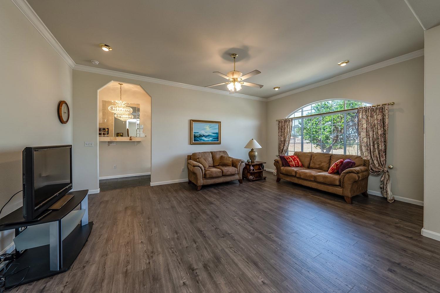 16601 La Canada Road Madera, CA 93636 - Photo 5 of 40 a living room with furniture and a flat screen tv