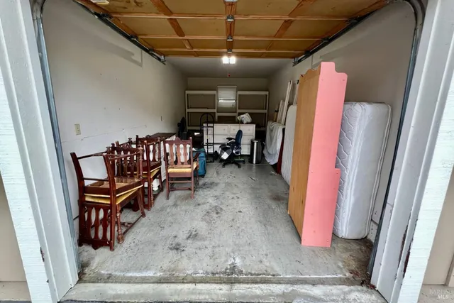 a view of livingroom with furniture and a rug