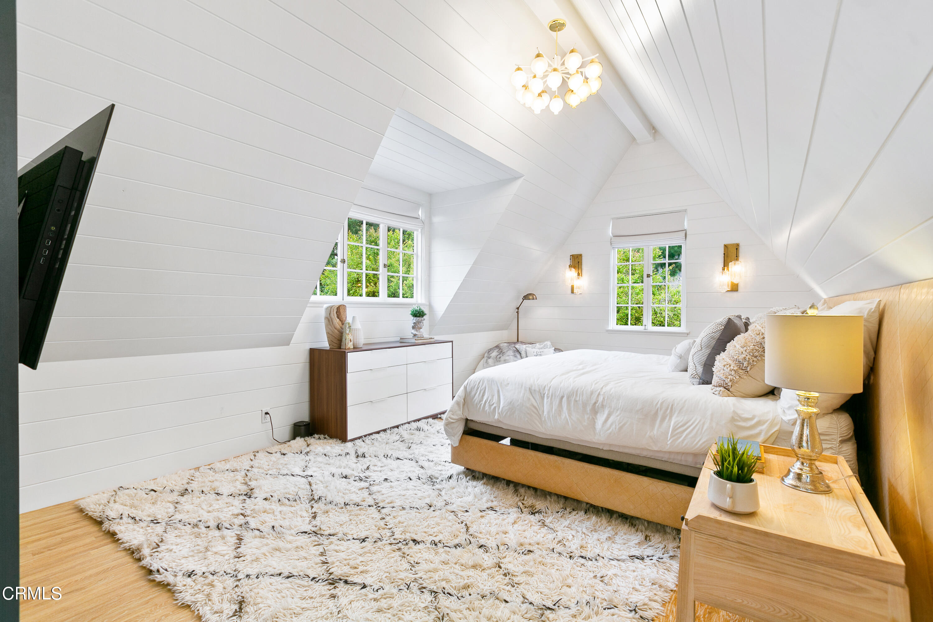 1665 Braeburn Road Altadena, CA 91001 - Photo 15 of 33 a bedroom with a bed and a flat tv screen on dresser