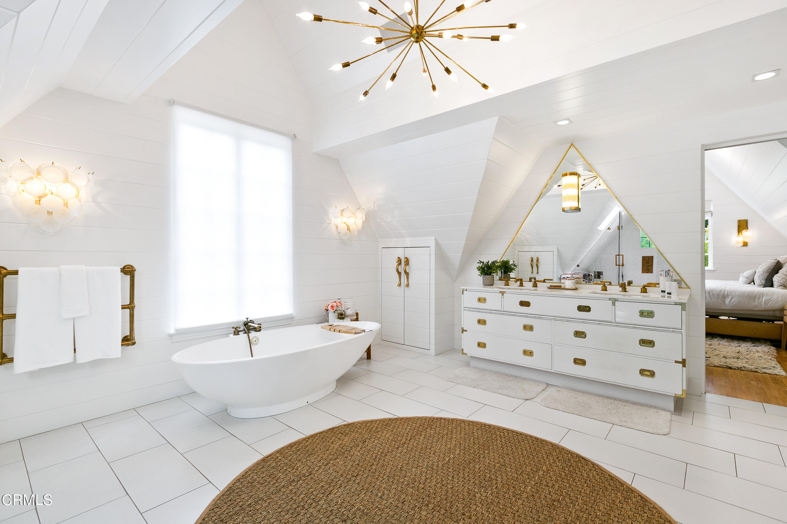 1665 Braeburn Road Altadena, CA 91001 - Photo 18 of 33 a spacious bedroom with a bed a chandelier and a large mirror